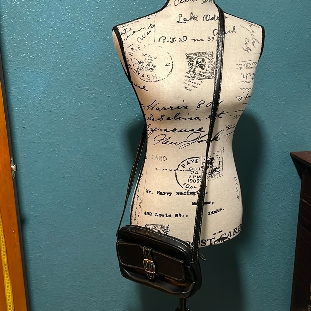 Small black crossbody purse, faux leather look w/silver colored metal buckle